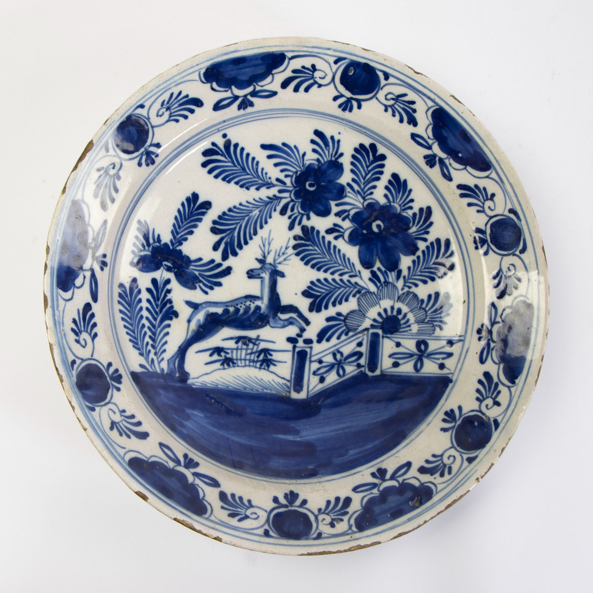 A Delft blue and white gadrooned chinoiserie dish, 17th C and 2 blue and white plates. - Image 6 of 7