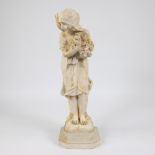 Alabaster statue of a girl with flowers