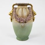 Art Nouveau vase with curiously polychrome decorated flower guirlandes and lion heads, Amphora, abou