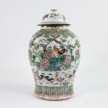 Chinese porcelain jar and its cover decorated in polychrome enamels with roosters and peonies. Late