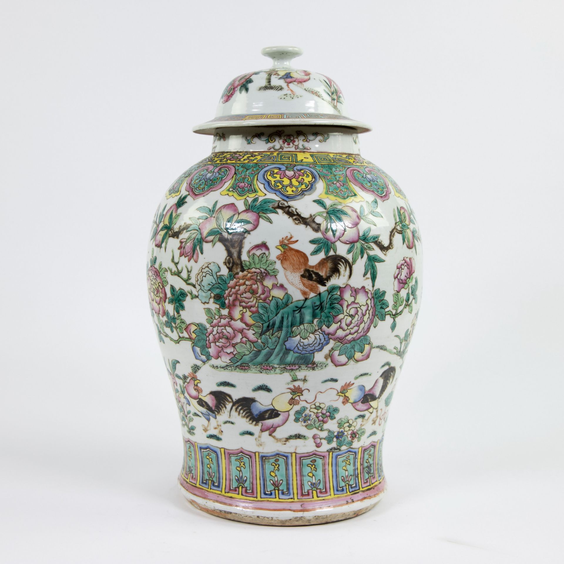 Chinese porcelain jar and its cover decorated in polychrome enamels with roosters and peonies. Late 