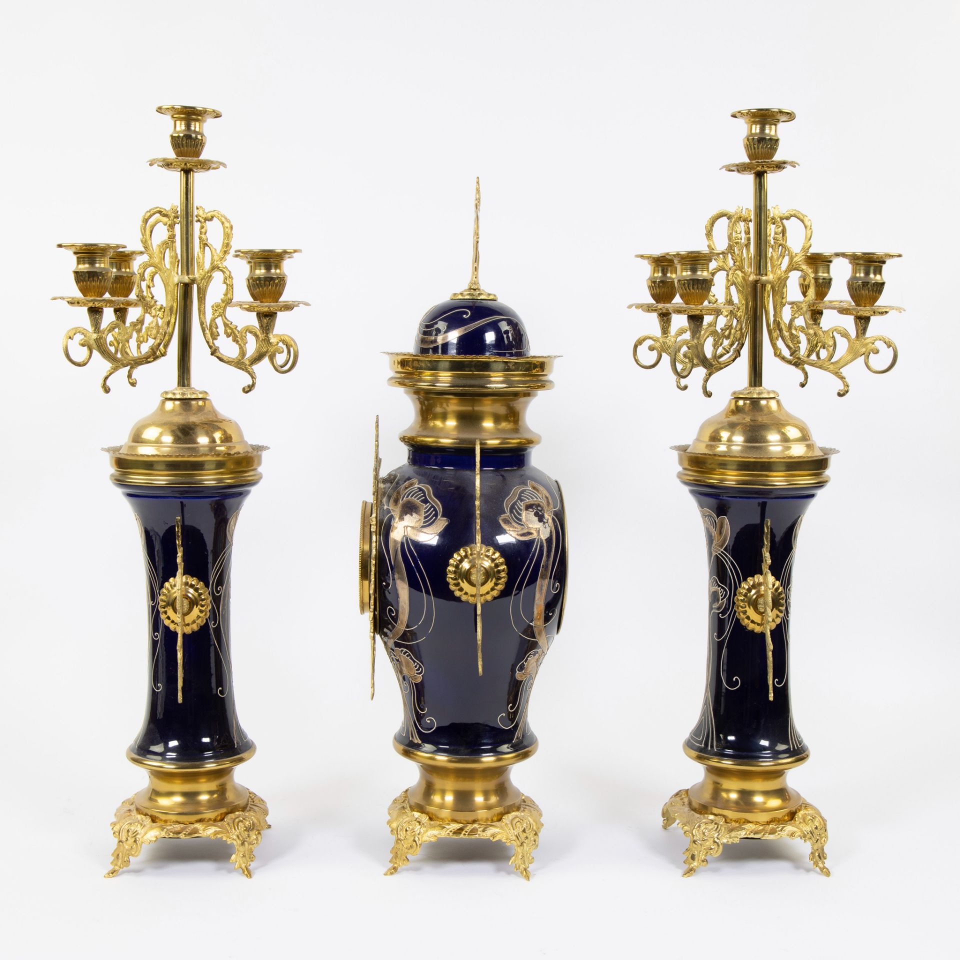 Three piece faience garnish decorated with stylized whiplash motifs and gilt brass, candlesticks wit - Image 2 of 4