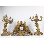An impressive three-part-piece gilded Louis XV clock from famous French clockmaker Guiche Palais Roy
