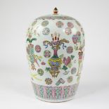 Chinese famile rose jar and its cover decorated with precious objects and a variety of decorative ro