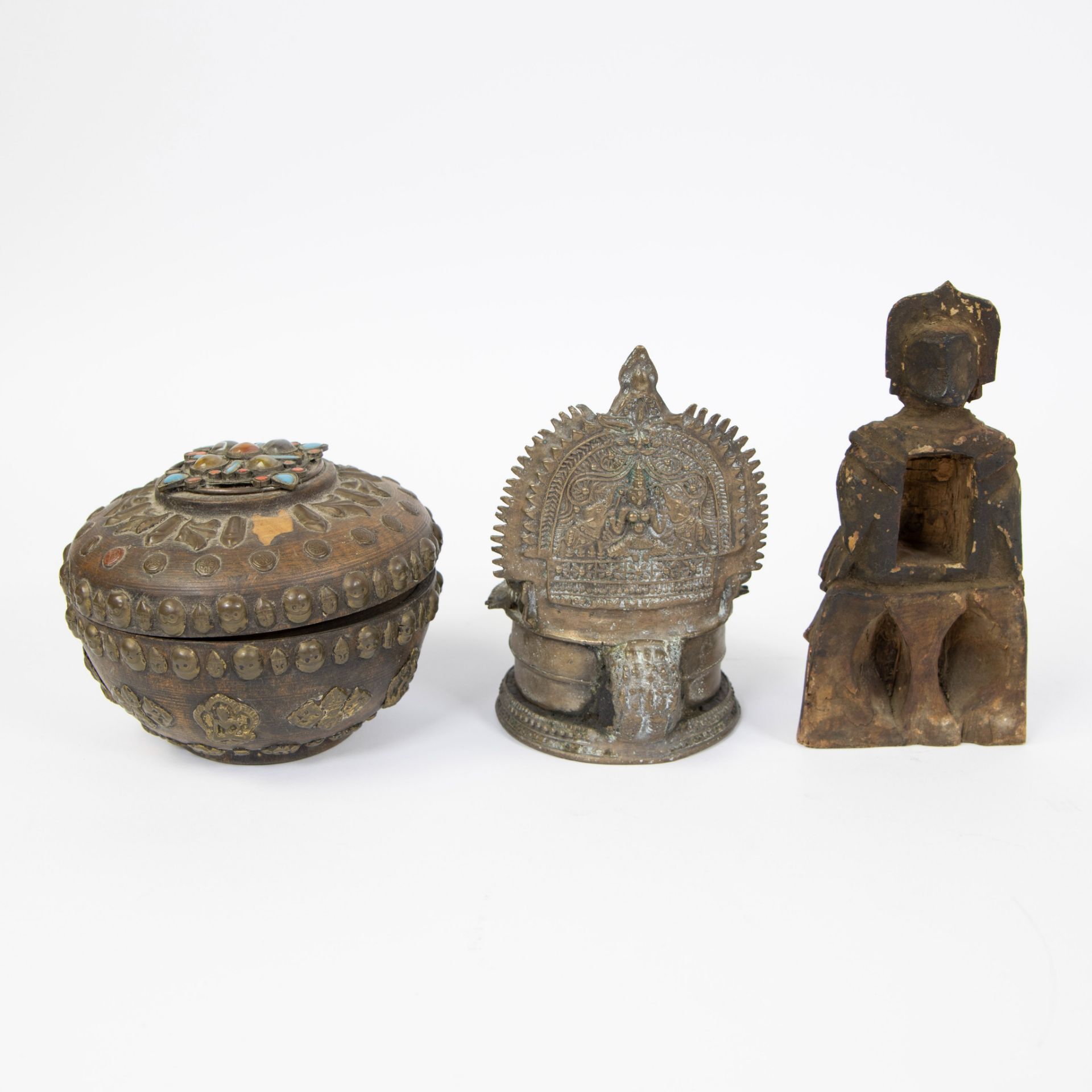 Collection of Tibetan, offering pot inlaid with stones and skulls, bronze oil lamp and wooden Buddha - Image 3 of 5