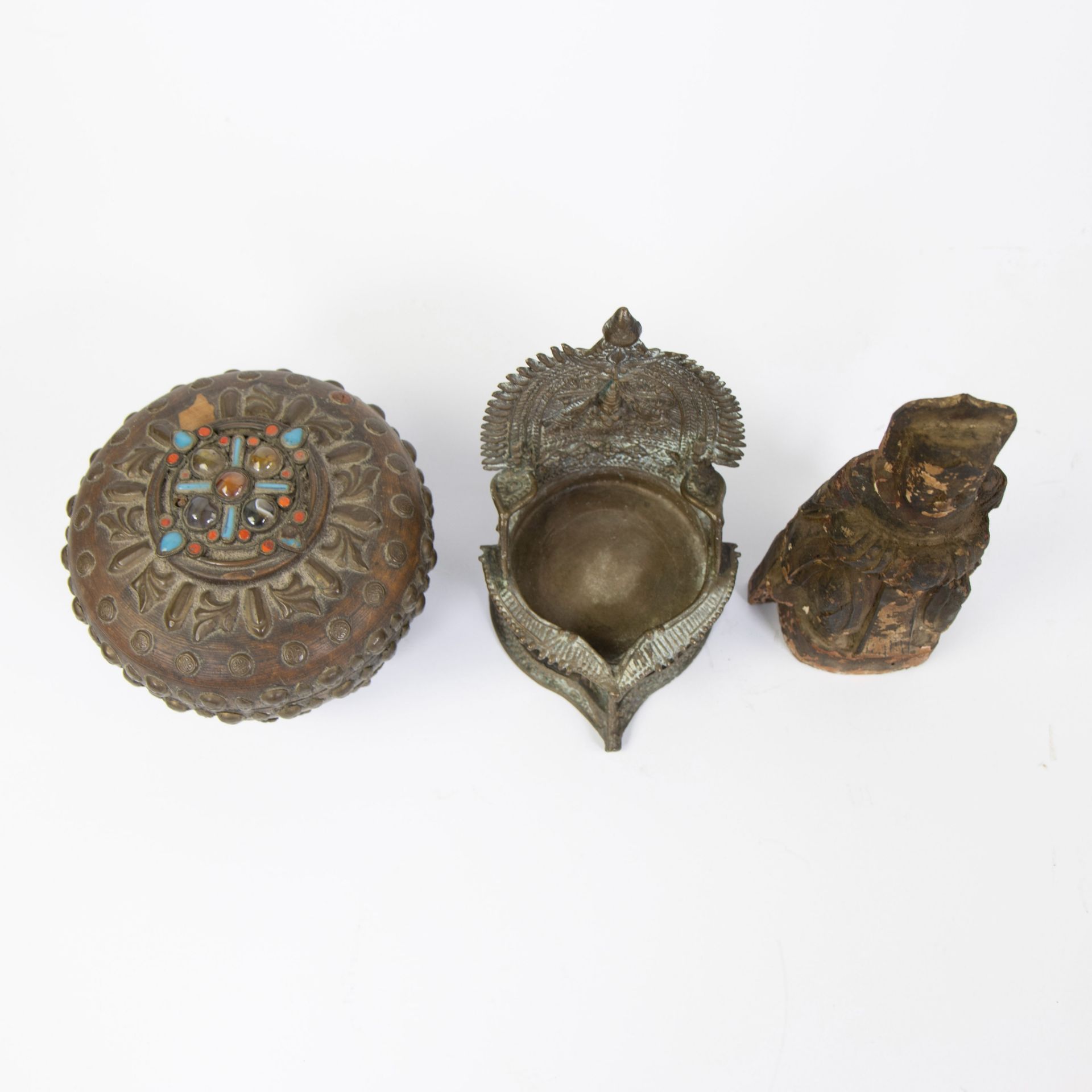 Collection of Tibetan, offering pot inlaid with stones and skulls, bronze oil lamp and wooden Buddha - Image 5 of 5