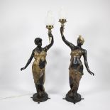 2 imposing statues in bronze and gilt bronze of Venetian ladies, each carrying a torch as a lampadai