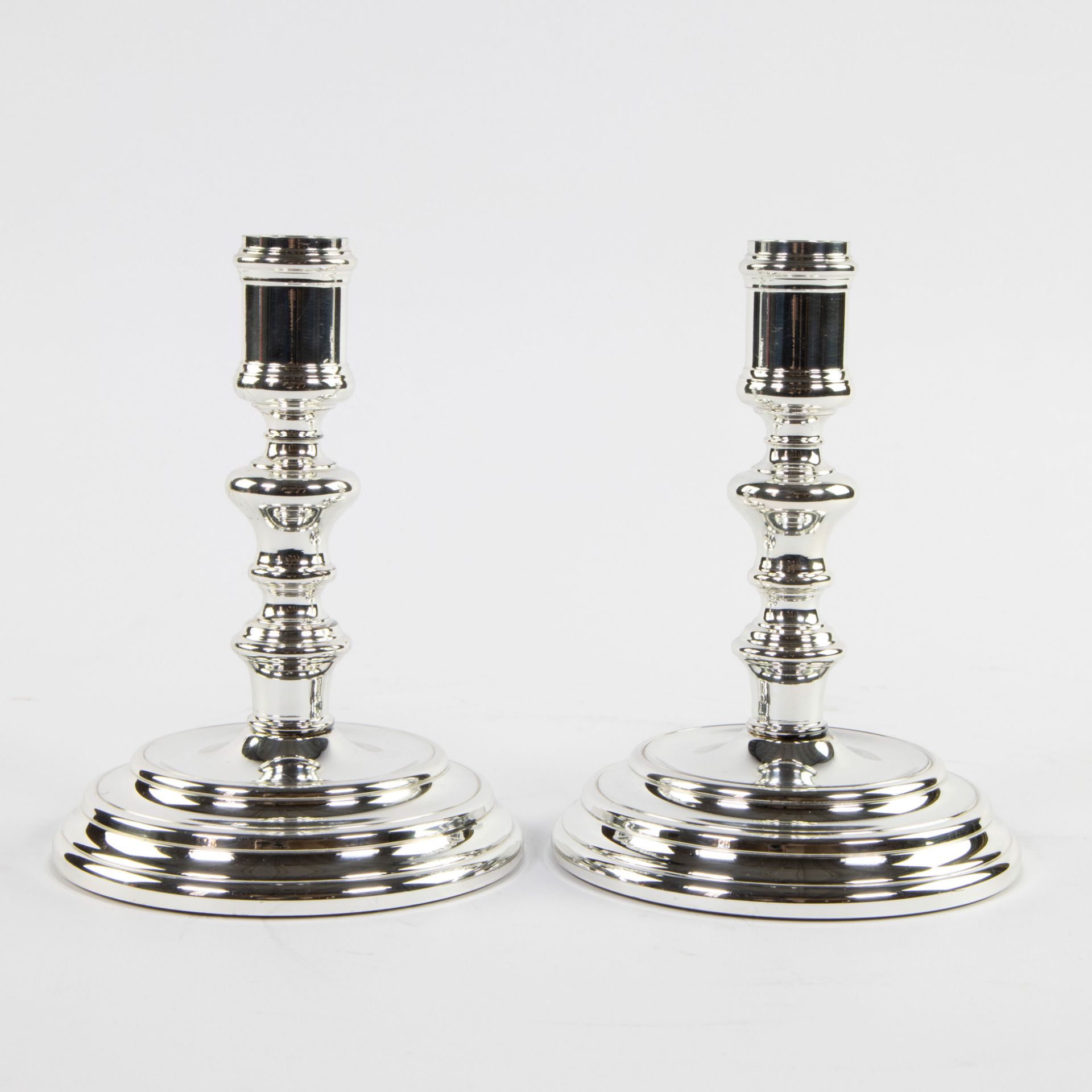 A pair of Christofle candlesticks, marked