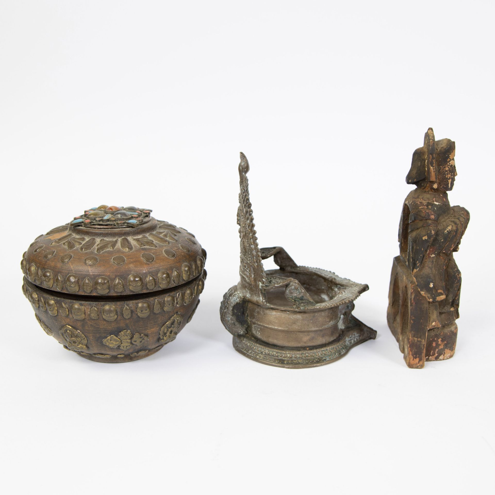 Collection of Tibetan, offering pot inlaid with stones and skulls, bronze oil lamp and wooden Buddha - Image 4 of 5