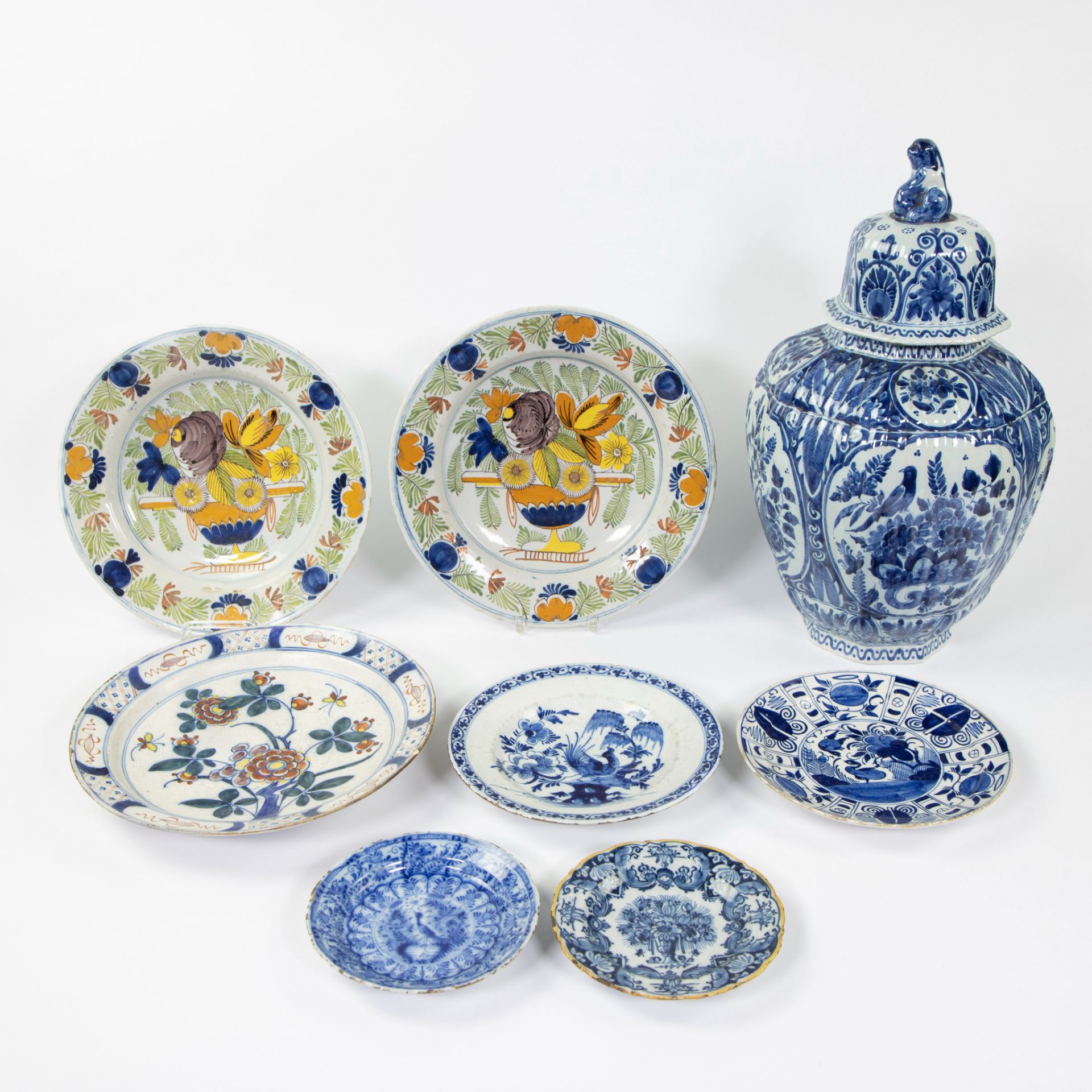 Large lot Delft, polychrome plates, blue including peacock plate and lid vase marked AK (Adrianus Ko