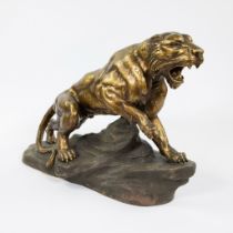 Armand FAGOTTO, gilt patinated terracotta of a panther on a rock, circa 1940, signed.