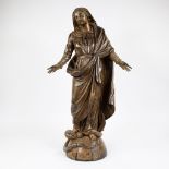 Wooden statue of Mary Immaculate Conception, trampling a twisting serpent from the earthly paradise,