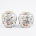 Two porcelain jars, decorated in famille rose enamels with prcious objects and auspicious symbols. M