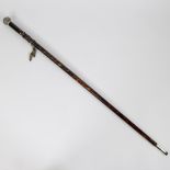 19th century walking stick made of tortoiseshell with knob in gold and silver