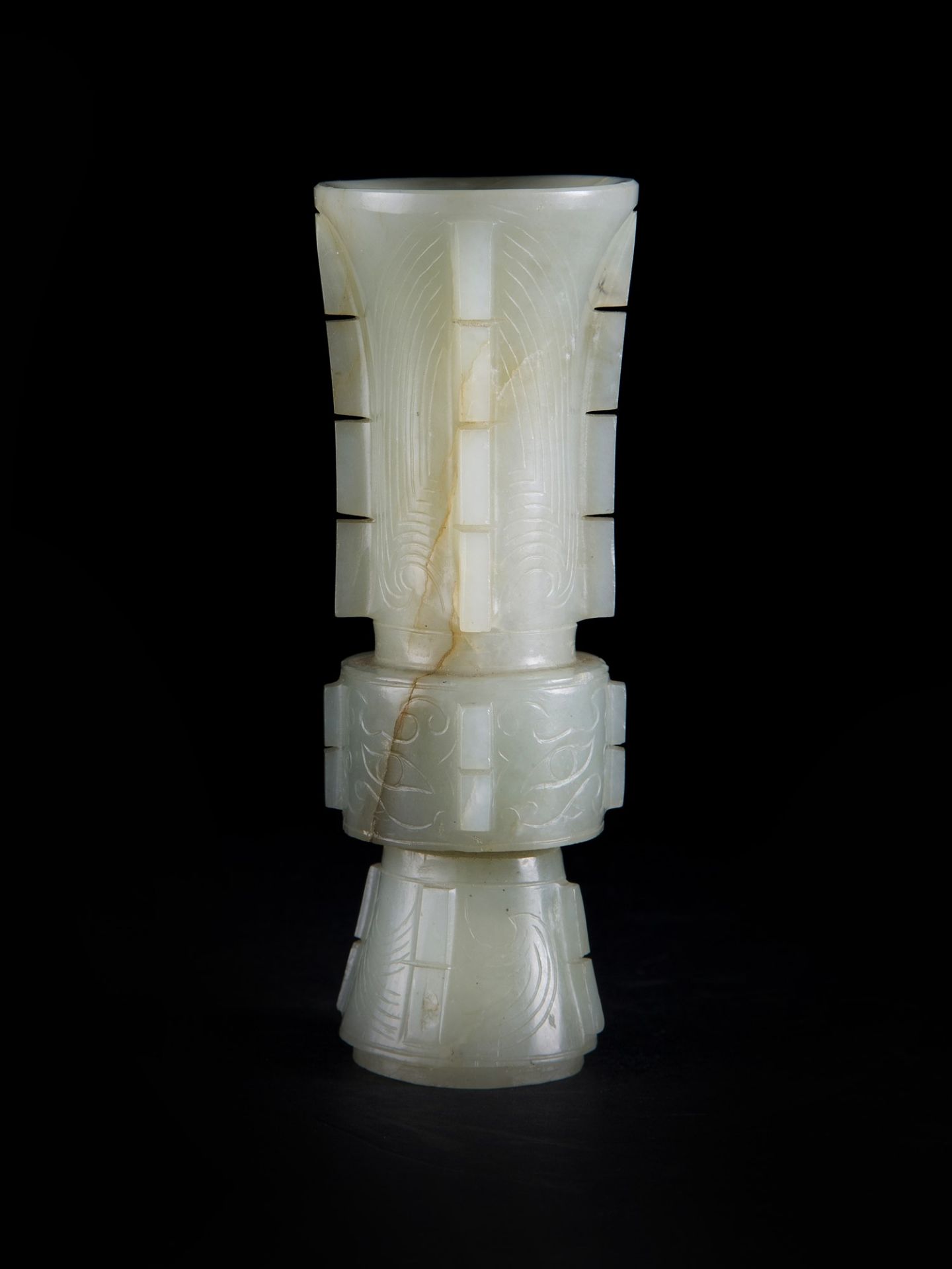 A SMALL CELADON JADE ARCHAISTIC â€˜GUâ€™ FORM VASE h. 11,5 cm