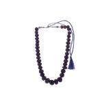 A BLUE ONYX BEAD NECKLACE