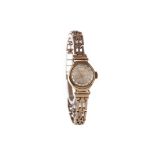 A LADY'S KERED NINE CARAT GOLD MANUAL WIND WRIST WATCH