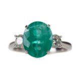 A CERTIFICATED TREATED EMERALD AND DIAMOND RING