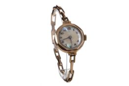 A LADY'S NINE CARAT GOLD MANUAL WIND WRIST WATCH