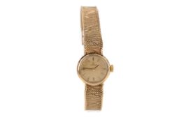 A LADY'S OMEGA NINE CARAT GOLD MANUAL WIND WRIST WATCH