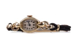 A LADY'S TUDOR ROLLED GOLD MANUAL WIND WRIST WATCH