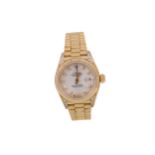A LADY'S ROLEX OYSTER PERPETUAL DATEJUST EIGHTEEN CARAT GOLD AUTOMATIC WRIST WATCH