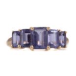 A TANZANITE FIVE STONE RING