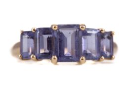 A TANZANITE FIVE STONE RING