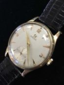 A GENTLEMAN'S OMEGA NINE CARAT GOLD MANUAL WIND WRIST WATCH