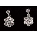 A PAIR OF DIAMOND DAISY CLUSTER EARRINGS