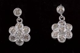 A PAIR OF DIAMOND DAISY CLUSTER EARRINGS