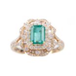 AN EMERALD AND DIAMOND RING