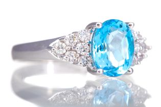 A CERTIFICATED TOPAZ AND DIAMOND RING