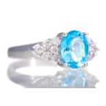 A CERTIFICATED TOPAZ AND DIAMOND RING