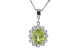 A PERIDOT AND DIAMOND CLUSTER PENDANT