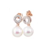 A PAIR OF PEARL AND DIAMOND EARRINGS