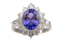 A CERTIFICATED TANZANITE AND DIAMOND RING