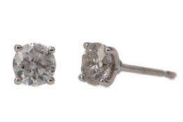 A PAIR OF DIAMOND STUD EARRINGS