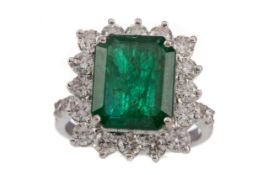 AN EMERALD AND DIAMOND RING