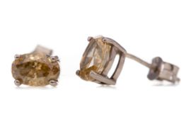 A PAIR OF FANCY YELLOW DIAMOND STUD EARRINGS