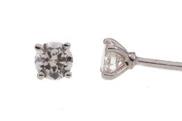 A PAIR OF DIAMOND STUD EARRINGS