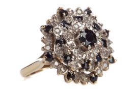 A SAPPHIRE AND DIAMOND CLUSTER RING