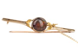 A BLACK OPAL BAR BROOCH