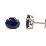 A PAIR OF TREATED SAPPHIRE STUD EARRINGS