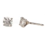 A PAIR OF DIAMOND STUD EARRINGS