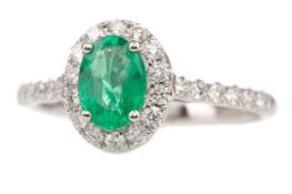 AN EMERALD AND DIAMOND RING