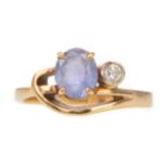 A TANZANITE AND DIAMOND RING