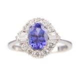 A TANZANITE AND DIAMOND RING