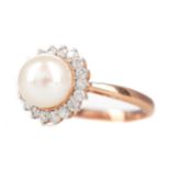 A PEARL AND DIAMOND RING