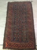 A BELOUCH BORDERED RUG